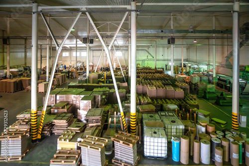 Big warehouse with paper rolls and printing material photo