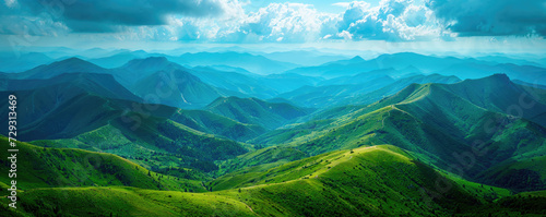 Panoramic view of lush green mountain ranges under a dramatic sky, showcasing the vast beauty of a natural landscape. © Александр Марченко