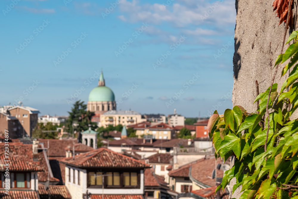 Scenic view of Parish of San Nicolo Vescovo at the Ossuary Temple in tourist town Udine, Friuli Venezia Giulia, Italy, Europe. Aerial viewing point of urban landscape. Travel destination in summer