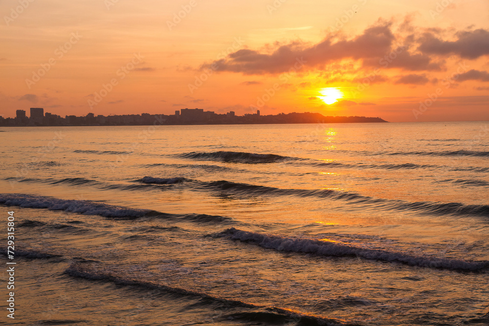 The sun rising at dawn from Alicante Beach. Spain 