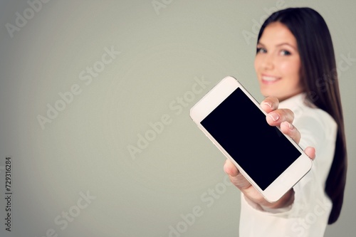 Young female hold the mobile phone