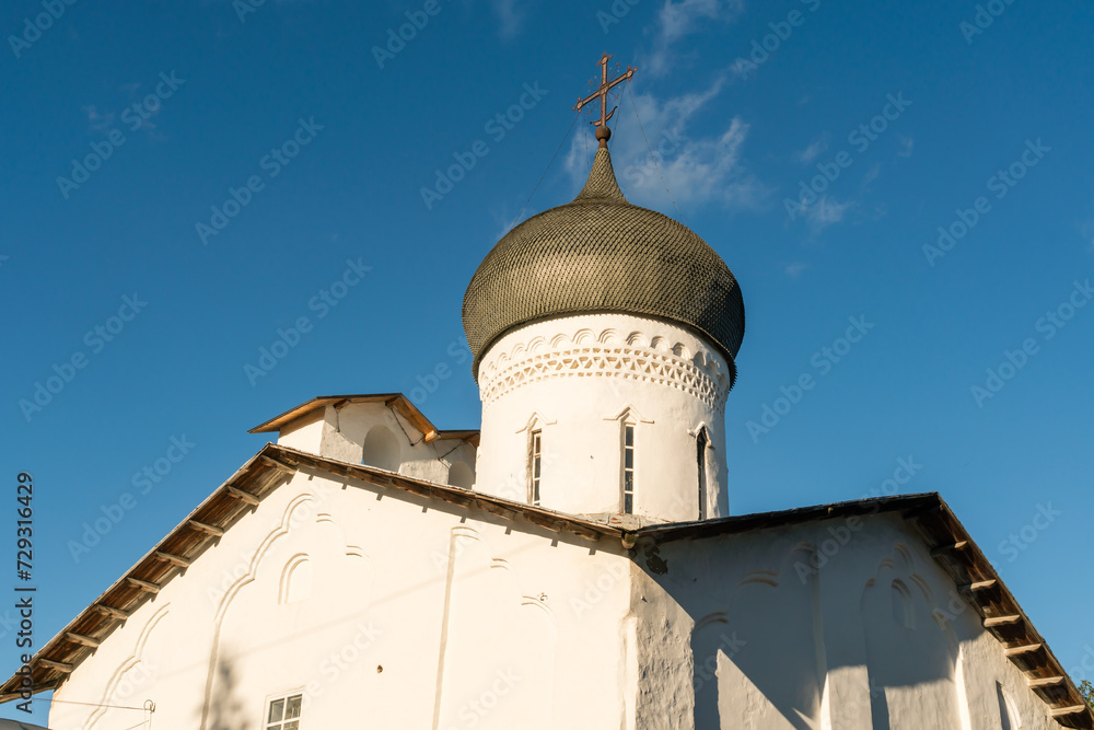 Pskov, Russia, September 6, 2023. The roof and domes of an ancient temple against the sky.