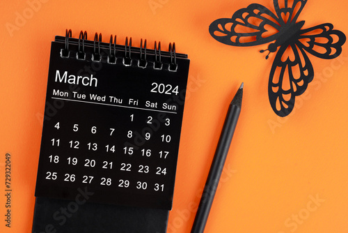 March 2024 desk calendar for the organizer to plan and reminder and butterfly paper.