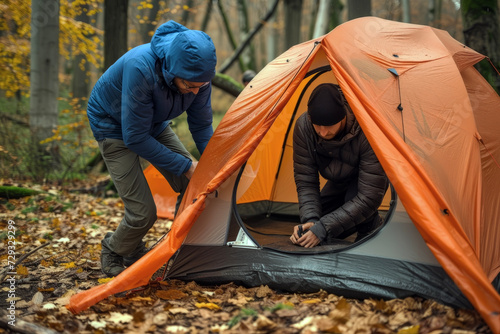 Campers Setting Up a Tent During a Hiking Trip. Expressing the Restful and Serene Moments in the Great Outdoors.