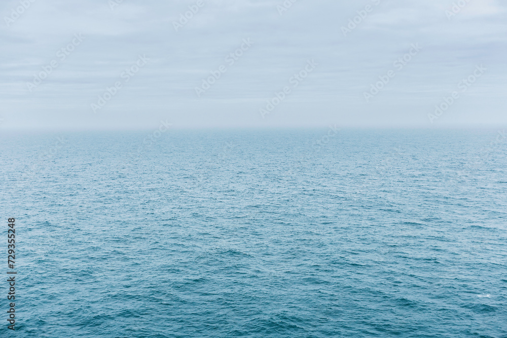 aerial view of water and clouds with horizon aerial view of water and clouds with horizon