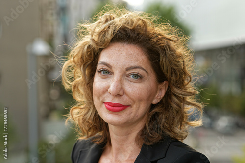 Woman with blond curls, Milano, Italy. photo