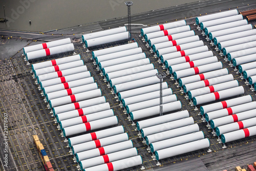 Aerial image of wind turbine parts stacked in container port being ready to ship. Bremerhaven, Germany photo