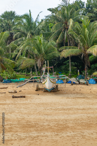 Traditional fishing boats on Sumenep beach, Madura island, Indonesia photo