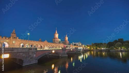 Berlin Germany time lapse, night city skyline at Oberbaum Bridge and Spree River photo