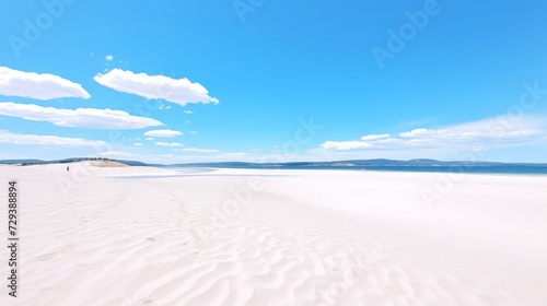 Beautiful white sand dunes on a background of the blue sky