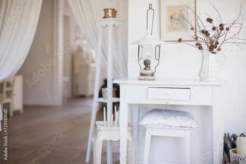 Interior still life of white interior decorated house in a shabby chic style.