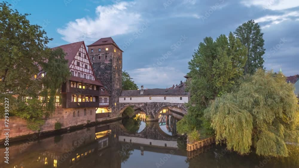 Nuremberg (Nurnberg) Germany time lapse, day to night city skyline at Wasserturm and Pegnitz River view from Max Bridge Nuremberg (Nurnberg) Germany time lapse, day to night city skyline at Wasserturm and Pegnitz River view from Max Bridge