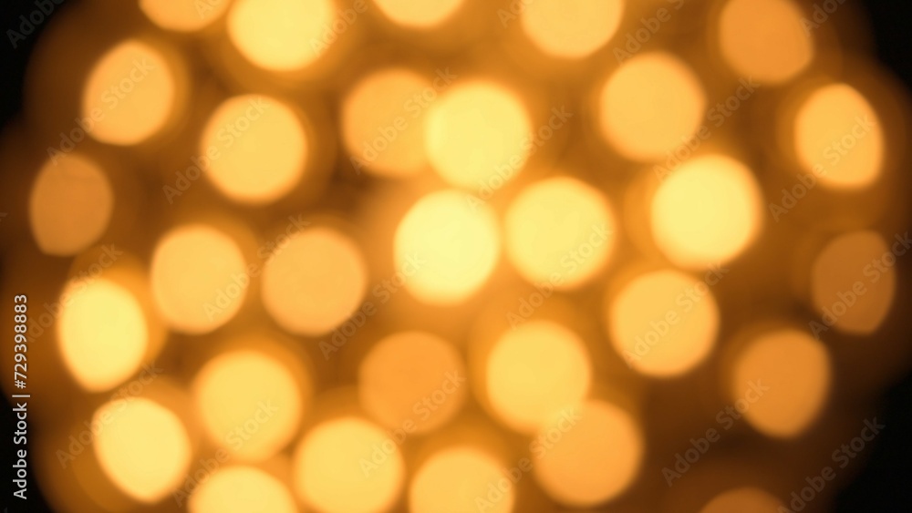 Flame of burning candles in defocus. Blur with bokeh effect from burning candle flame. Memorial Day. Background for holiday, advertising and design projects. Top view. Flame of burning candles in defocus. Blur with bokeh effect from burning candle flame. Memorial Day. Background for holiday, advertising and design projects. Top view.