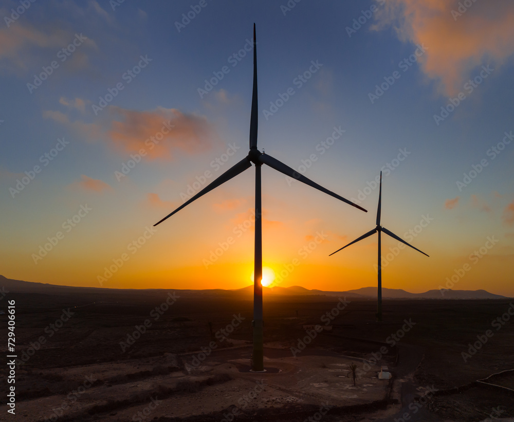 Aerial image silhouette of the wind turbines at sunset near Corralejo Lajares Villaverde Fuerteventura Canary Islands Spain