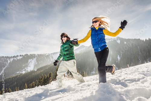 Couple having fun in the mountains in winter. Achenkirch, Austria  photo