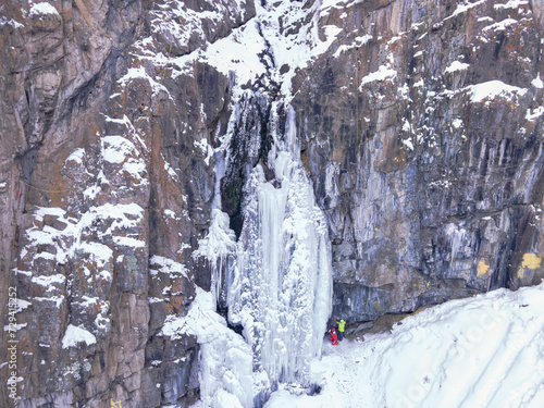 Frozen waterfall in the mountains near Almaty. Butakovsky waterfall in winter. Aerial photography of a waterfall in winter. photo