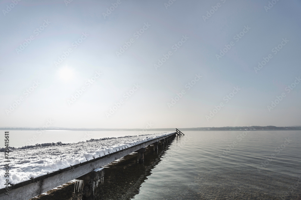 Winter lake landscape with blue skies and snowy grounds. Winter lake landscape with blue skies and snowy grounds.