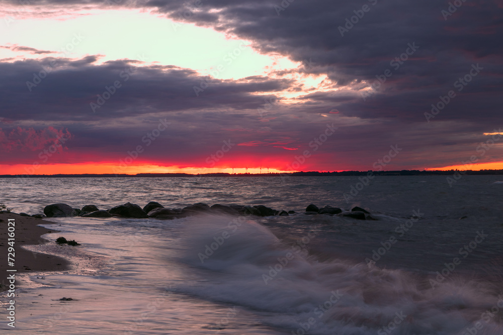 Scenic seascape with dramatic red sky at dawn. Scenic seascape with dramatic red sky at dawn.