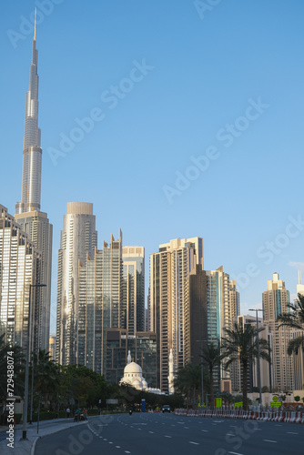 Futuristic and modern commercial and residential highrise tower skyscraper architecture with glass facades and clean lines in downtown Dubai, United Arab Emirates for millionaires and high society