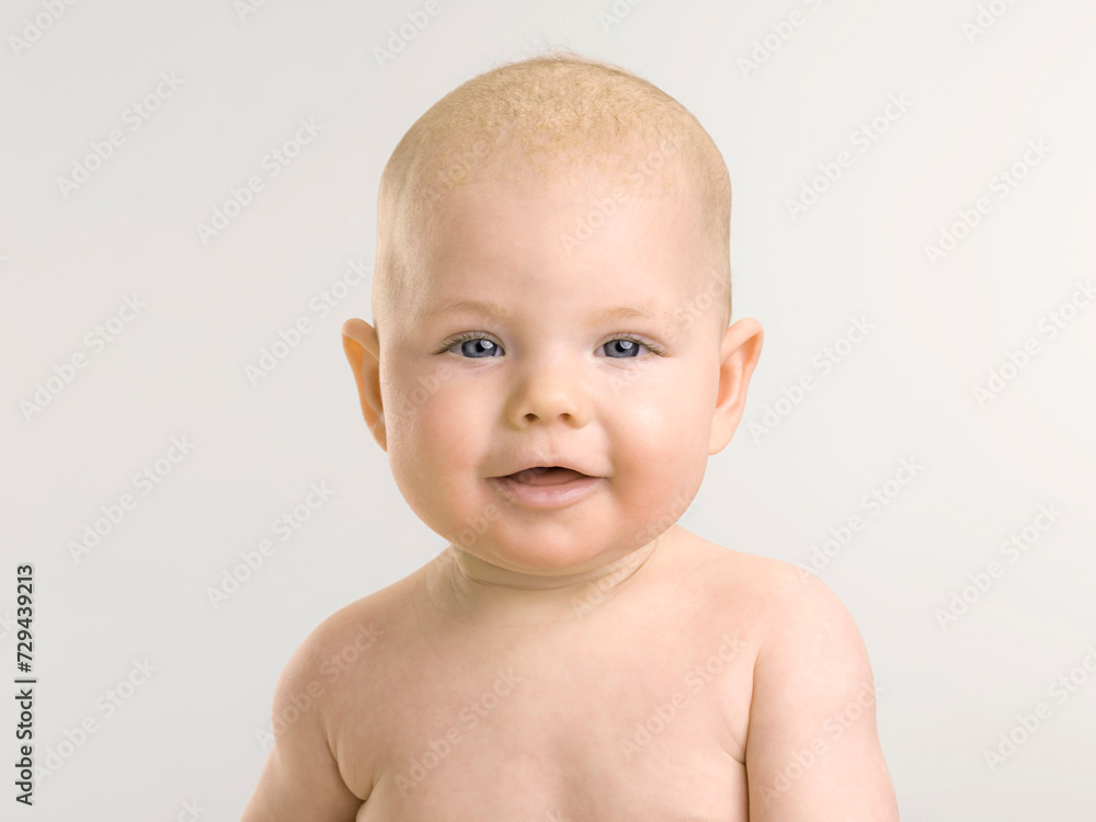 Studio Portrait of baby girl laughing in the camera. Munich, Germany Studio Portrait of baby girl laughing in the camera. Munich, Germany