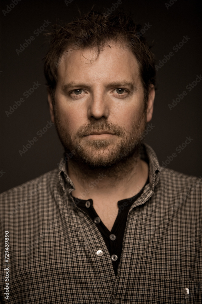 Studio portrait of man with black background. Munich, Germany Studio portrait of man with black background. Munich, Germany