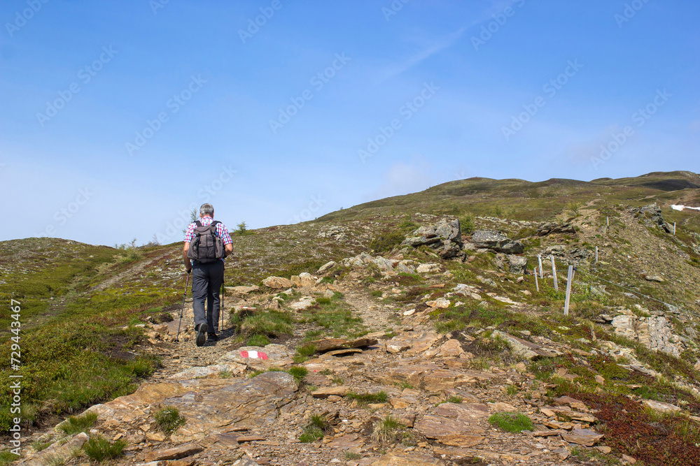 man trekking in the mountains, Alps in Austria, Lienzer Dolomiten, East Tyrol