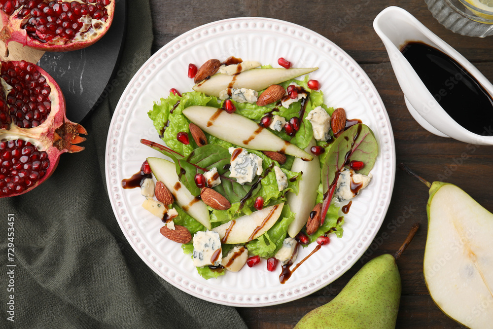 Delicious pear salad with sauce on wooden table, flat lay Delicious pear salad with sauce on wooden table, flat lay