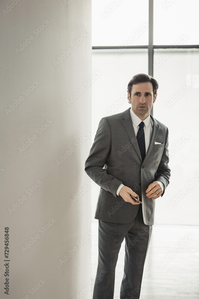 Business man in a suit looking into the camera. Munich, Germany Business man in a suit looking into the camera. Munich, Germany