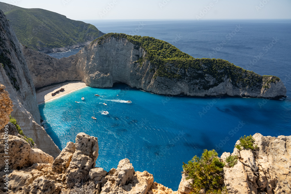 Fototapeta premium Aerial view of Navagio beach on Zakynthos island, Greece. Shipwreck Beach or Agios Georgios. is exposed cove in the Ionian Islands of Greece. Shipwreck on the beach in Zakynthos island, Greece.