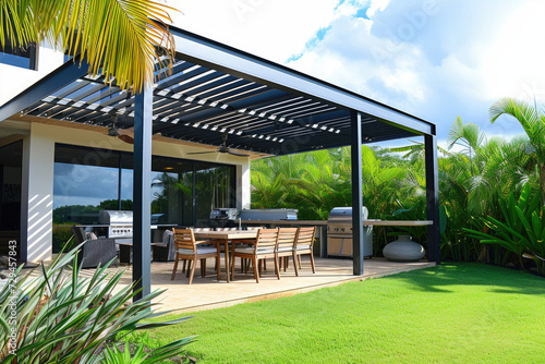 Modern patio furniture includes a pergola shade structure, an awning, a patio roof, a dining table, seats, and a metal grill, grass lawn, tropical garden, and a mini pool photo