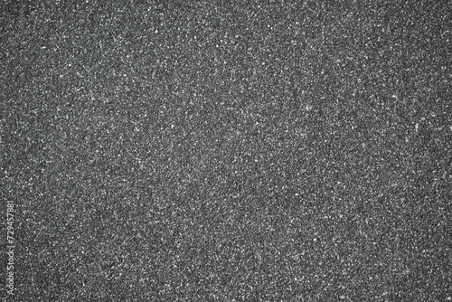 sand floor, black stone grains rough surface texture material background. Coarse plaster on the wall in light gray color - seamless abstract with porous structure - surface covered with fine sand