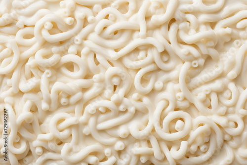 udon noodles, highlighting their smooth texture against a backdrop of white and yellow tones