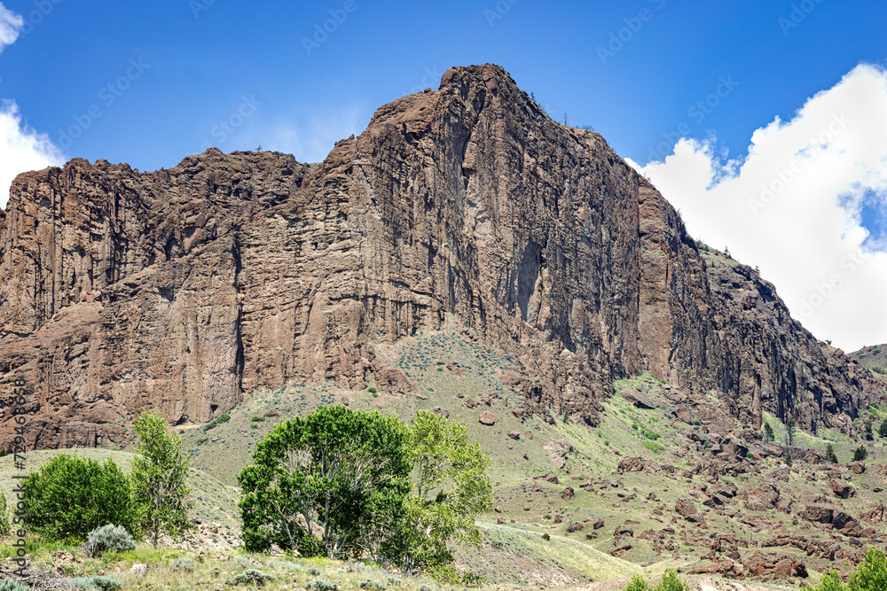 Mountain and canyon landscape with hills and trees during summer in northwest Wyoming plains wilderness Wyoming, USA Mountain and canyon landscape with hills and trees during summer in northwest Wyoming plains wilderness Wyoming, USA
