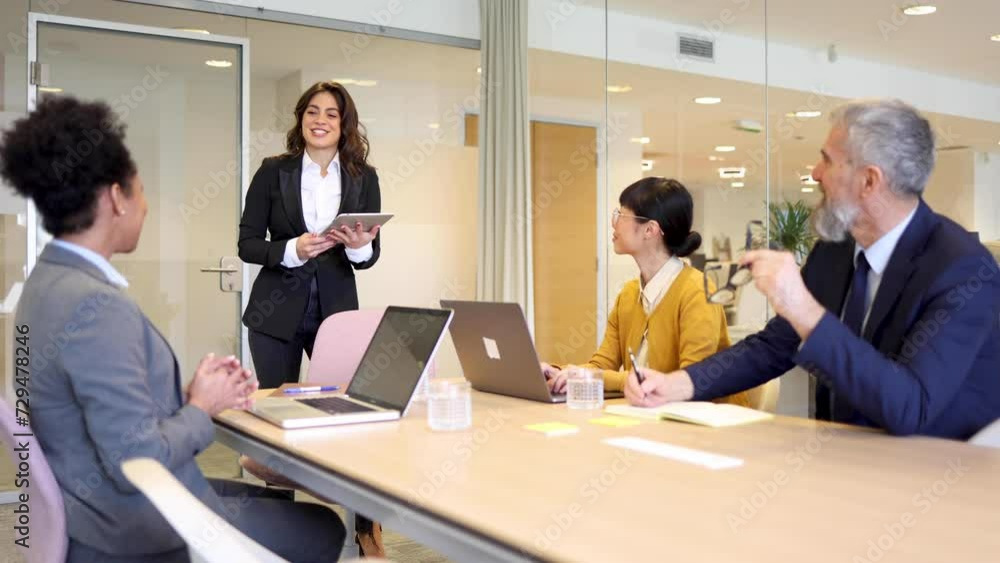 Businesswoman presenting a business plan on a meeting Businesswoman presenting a business plan on a meeting