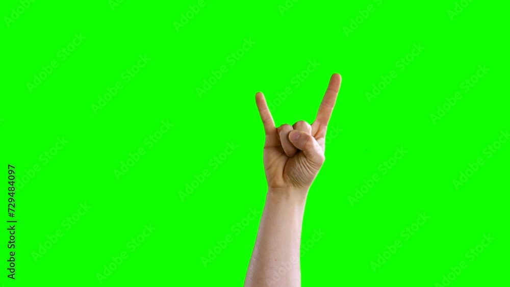 Male hand enters frame from the front side, shows rock it and exits the frame Male hand enters frame from the front side, shows rock it and exits the frame