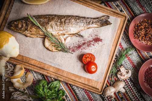 Grilled fish, salads and vegetables. Seafoods, grilled meat, meze, raki, ouzo, appetizers and salads on the table in Greek or Turkish Fish Restaurant for dinner or lunch at the beach.