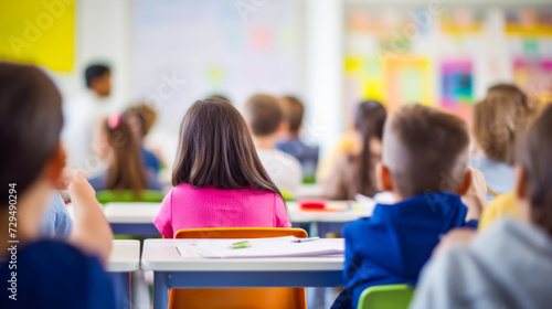 Elementary school classroom with young students sitting at their desks