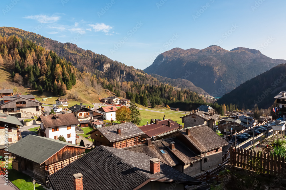 Scenic view of remote alpine village of Sauris di Sotto in Carnic Alps, Friuli Venezia Giulia, Italy. Serene tranquil atmosphere in Italian Alps. Traditional wooden residential houses in mountain area