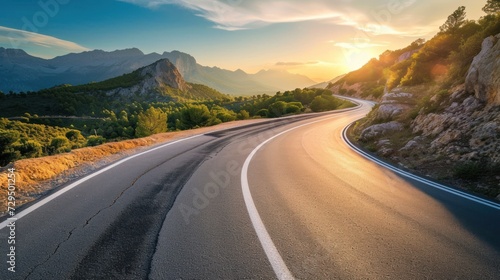 Mountain road at sunset. Beautiful curved roadway. © inthasone