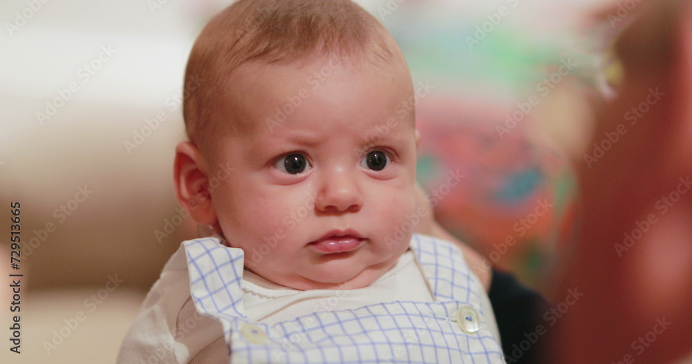 Baby infant with confused concerned expression emotion