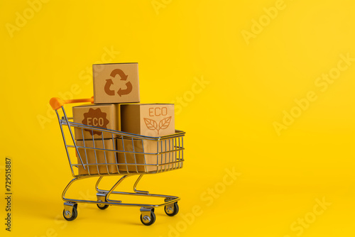 For products with cardboard boxes in it on a yellow background the concept of discounts and promotions organic products