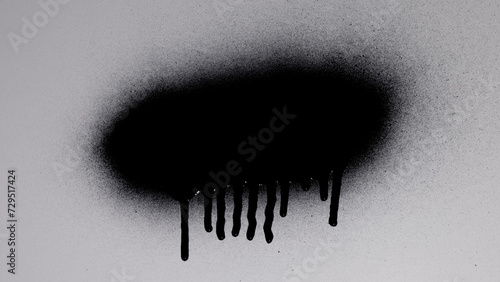 Black Spray Paint On A White Background photo