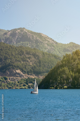 Solitary Voyage. Exploring the Majestic Mountain Lake on a Serene Summer Day