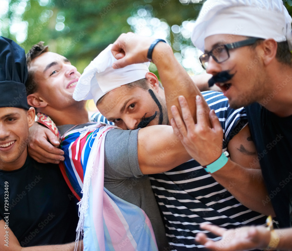 Obraz premium Halloween, party and men friends in a park with chef, costume or holiday celebration. Forest, festival and people in nature for fun, vacation or bonding and an event on weekend, day off or reunion