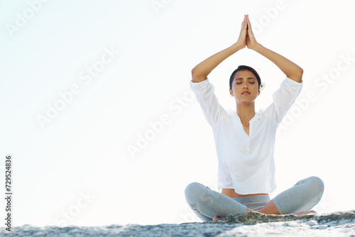 Woman  yoga and meditation at beach with space  peace and zen breathing with namaste hands over head. Girl  Indian person and outdoor with mockup  nature or holiday on sand for mindfulness in Mumbai