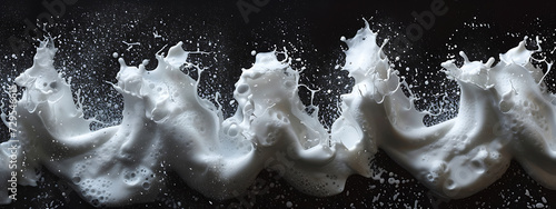 four samples of white foam with a black background in