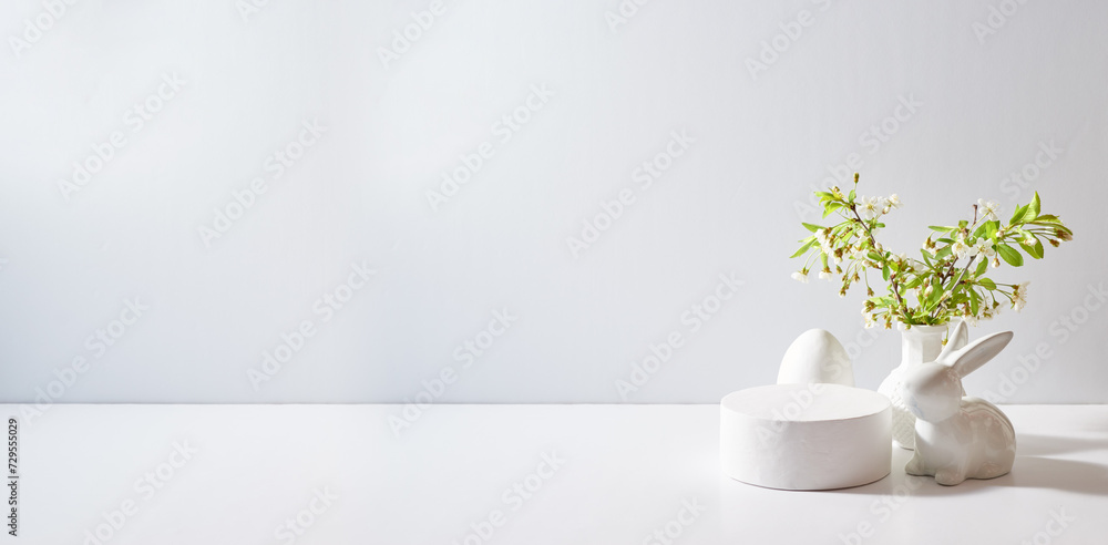 Empty round white podium for product presentation. Spring flowers in a vase and easter eggs on a light background - obrazy, fototapety, plakaty 