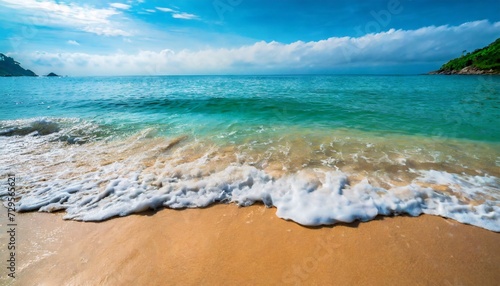 beautiful soft blue ocean wave on fine sandy beach