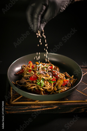 Wok noodles sprinkled with sesame seeds
