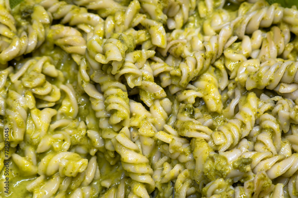 Fusilli pasta with pesto sauce, with space for text